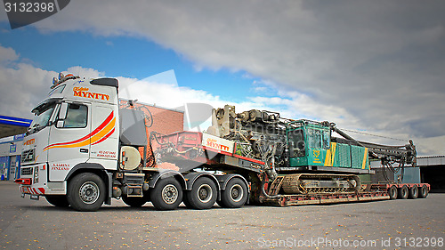 Image of Volvo FH16 Truck Hauls Pile Driver on Double Drop Deck Trailer