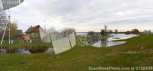 Image of Spring panorama with the river in flood cloudy day