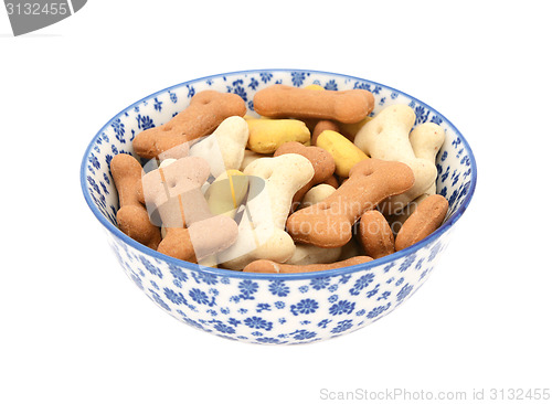 Image of Dog biscuits in a blue and white china bowl