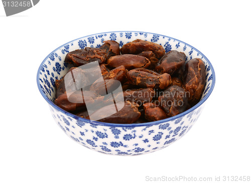 Image of Whole dates in a blue and white china bowl