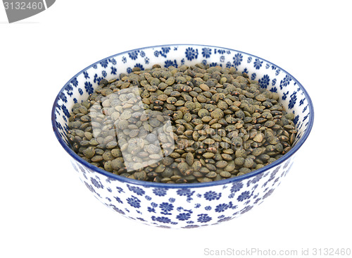 Image of Marbled dark green lentils in a blue and white china bowl
