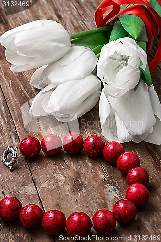 Image of tulips and womens coral beads