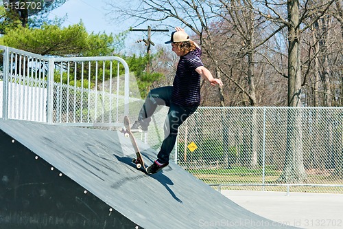 Image of Skateboarder On a Skate Ramp