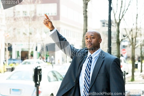 Image of Man Hailing a Taxi Cab