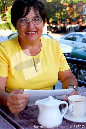 Image of Mature woman reading