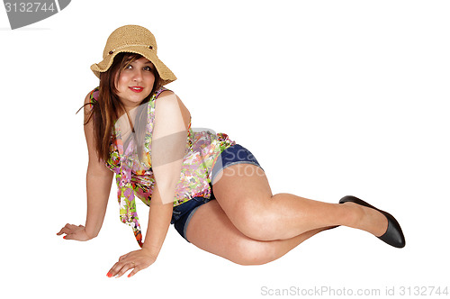 Image of Woman sitting on floor.
