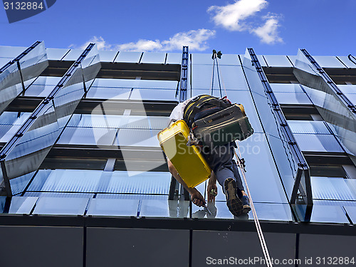 Image of Climber wash glass facade