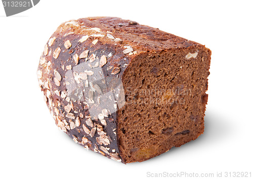 Image of Lying half unleavened black bread with seeds and dried fruit