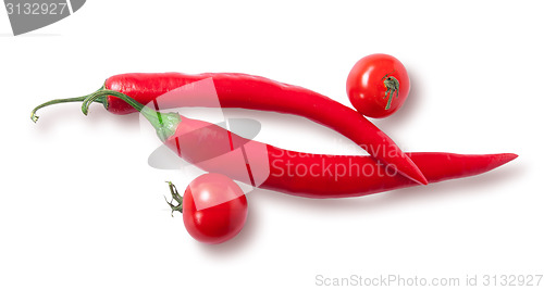 Image of Two chili pepper and two cherry tomatoes top view