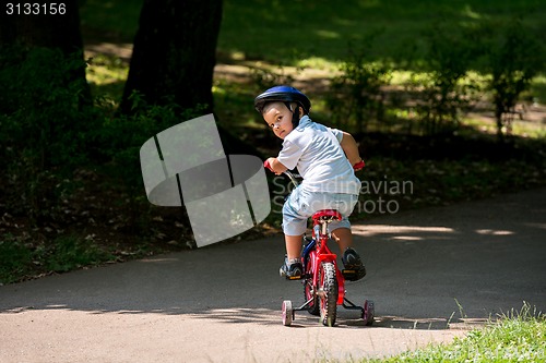 Image of grandfather and child have fun  in park