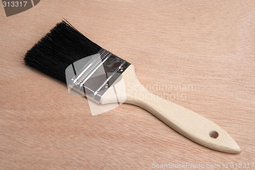 Image of Paint brush on wood background