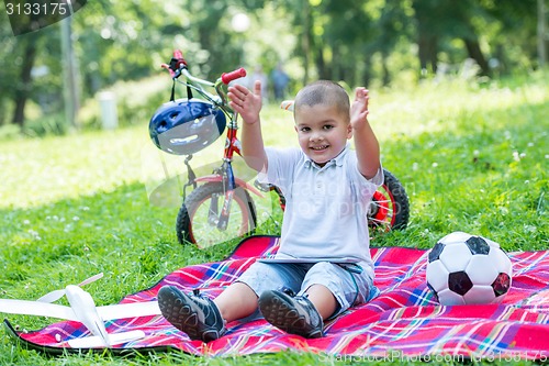 Image of boy with airpane toy