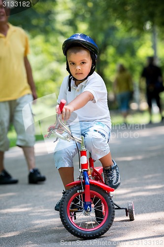 Image of grandfather and child have fun  in park