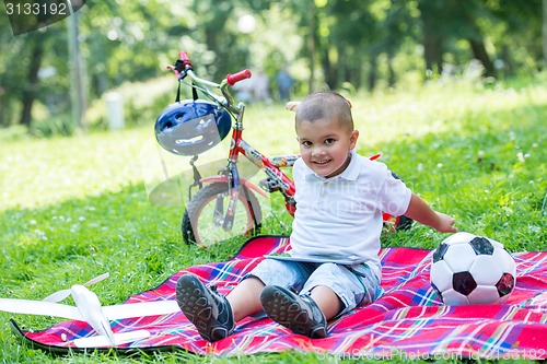 Image of boy with airpane toy