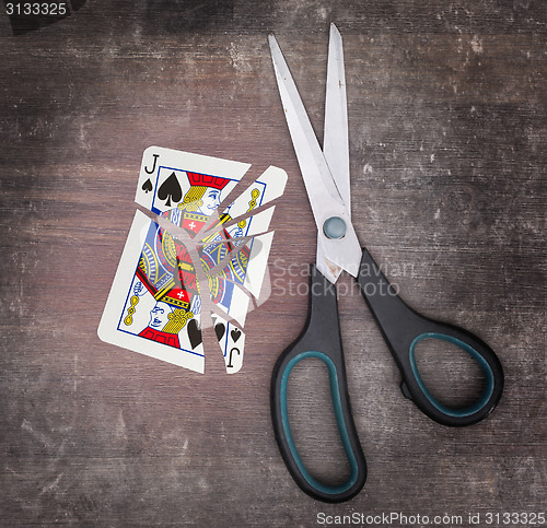 Image of Concept of addiction, card with scissors