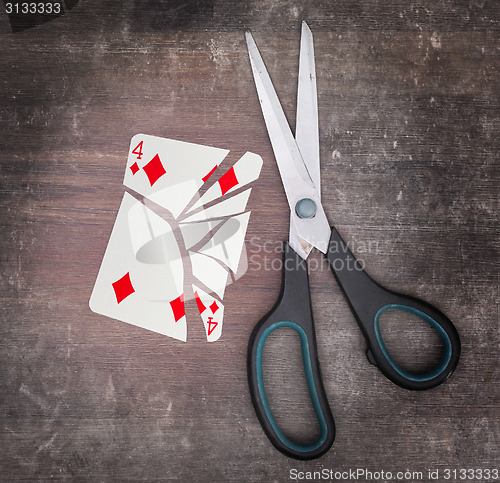 Image of Concept of addiction, card with scissors