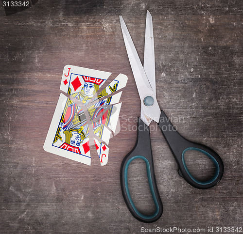 Image of Concept of addiction, card with scissors