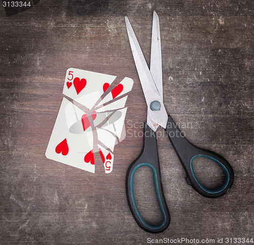 Image of Concept of addiction, card with scissors