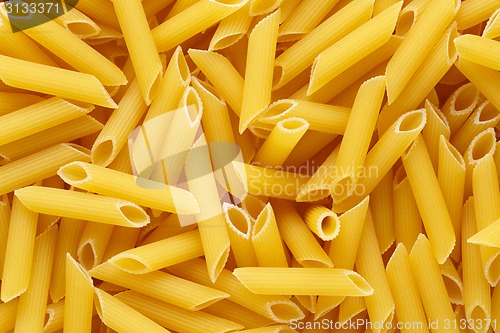 Image of Backgrund of italian penne rigate pasta