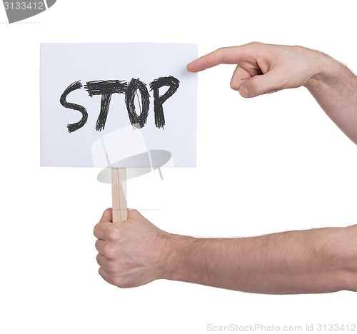 Image of Hand holding sign, isolated on white