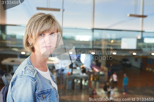 Image of Woman with backpack going on boarding