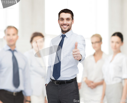 Image of handsome businessman with crossed arms