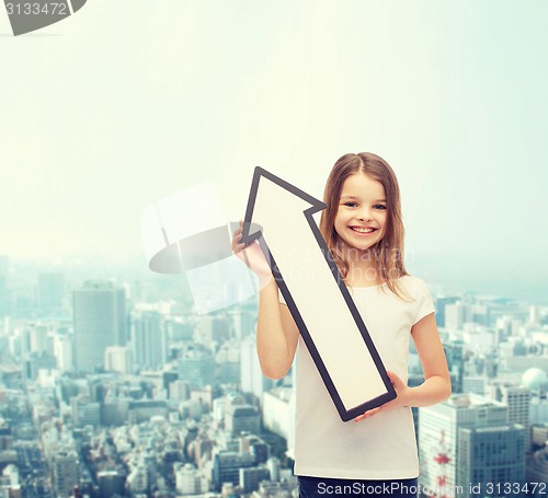 Image of smiling little girl with blank arrow pointing up