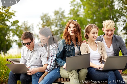 Image of students or teenagers with laptop computers