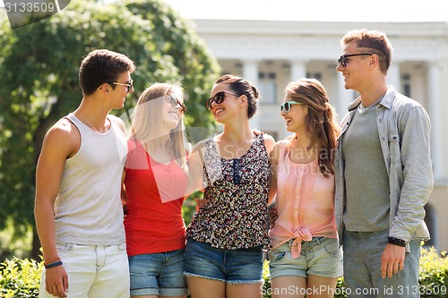 Image of group of smiling friends outdoors