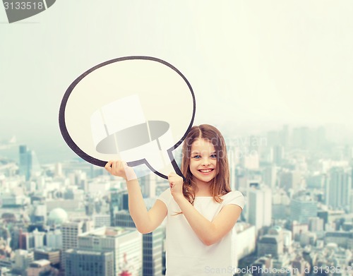 Image of smiling little girl with blank text bubble