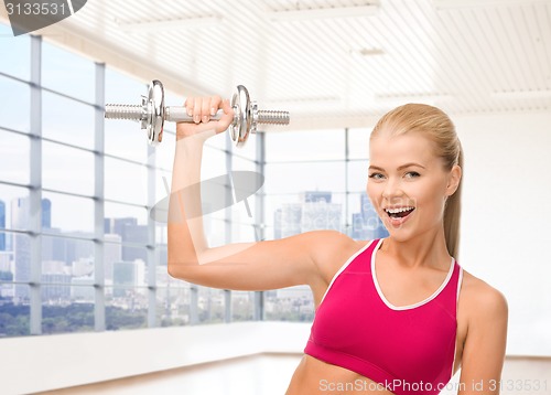 Image of close up of sporty woman flexing her bicep