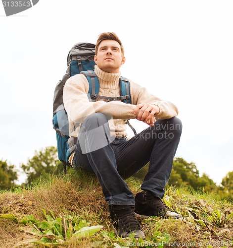 Image of man with backpack hiking