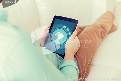 Image of close up of man with tablet pc computer at home