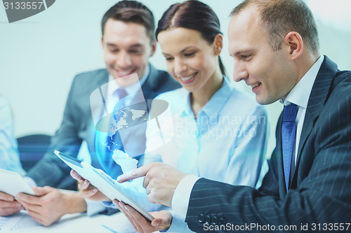 Image of business team with tablet pc having discussion