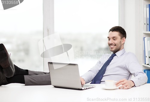 Image of smiling businessman or student with laptop