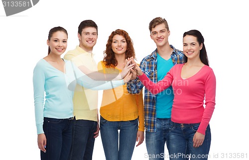 Image of smiling teenagers making high five