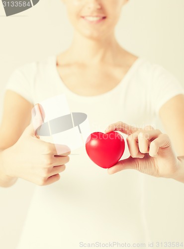 Image of woman hands with heart