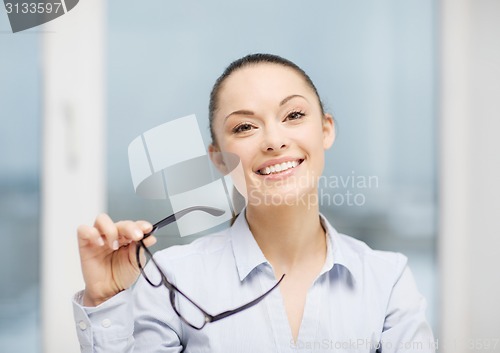 Image of laughing businesswoman with glasses