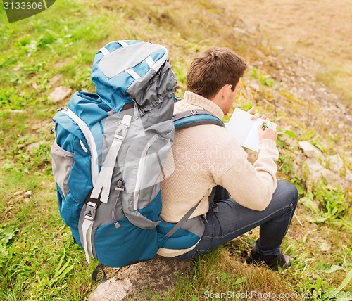 Image of man with backpack hiking