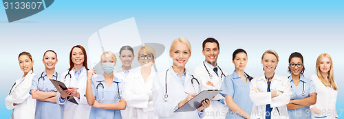 Image of smiling female doctors and nurses with stethoscope