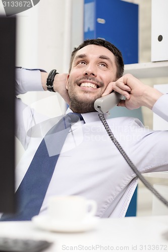 Image of smiling businessman or student with computer