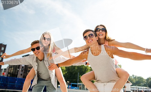 Image of smiling couple having fun in city