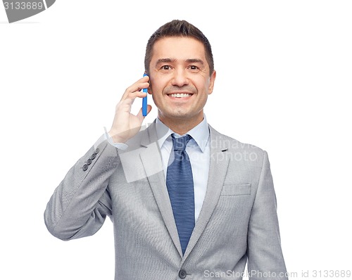 Image of happy businessman calling on smartphone