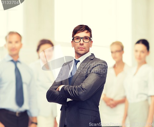 Image of attractive buisnessman or teacher in glasses