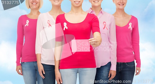 Image of close up of women with cancer awareness ribbons