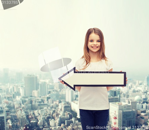 Image of smiling girl with blank arrow pointing left