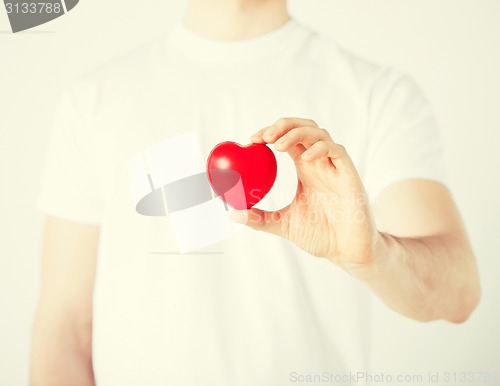 Image of man hands with heart