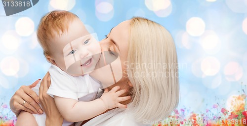 Image of happy mother with baby over natural background