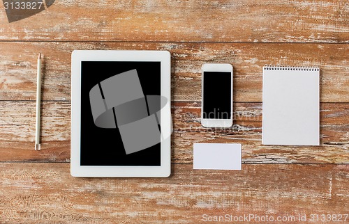 Image of close up of notebook, tablet pc and smartphone