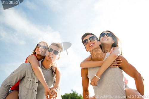 Image of smiling couple having fun in city